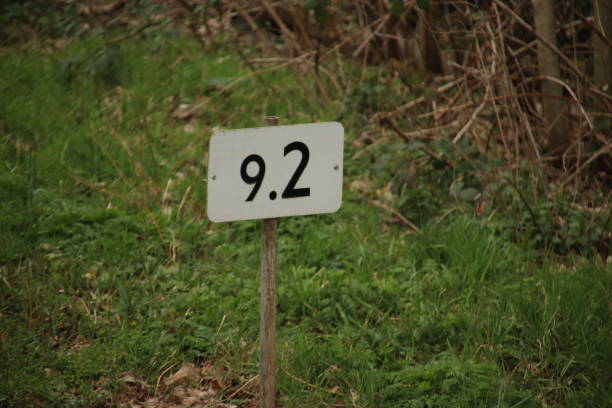 istock Distance kilometer sign in white with black along rail for train drivers 1166002668
