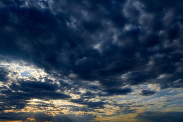 istock Beautiful sunset - dark sky with clouds and sunlight 1166008901