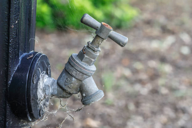 istock Water standpipe tap in cemetery close up 1166008939