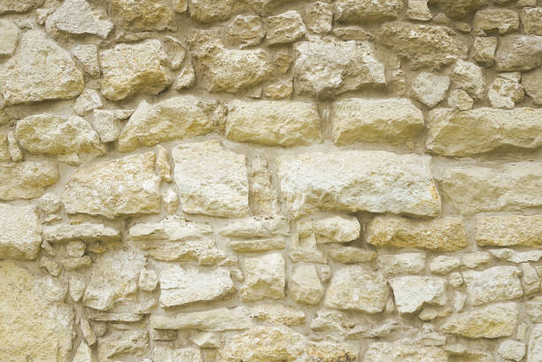 istock Beige stone mosaic wall background 1166010468