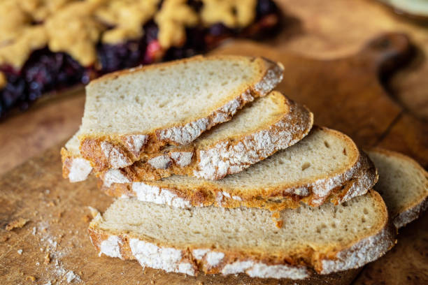istock Slices of bread on a wooden board. 1166010794
