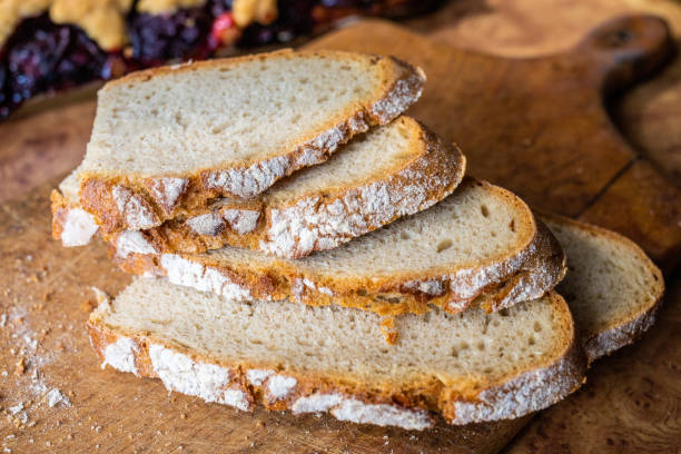 istock Slices of bread on a wooden board. 1166010820
