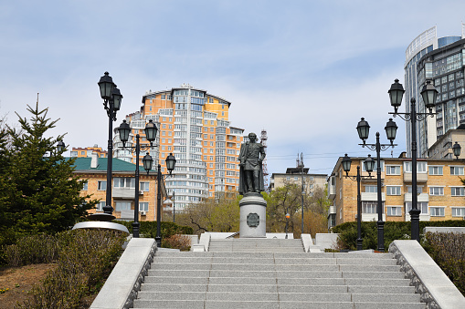 Vladivostok, Russia - April 28, 2019: City view and Monument to Muravyov-Amursky Governor-General of Eastern Siberia in Vladivostok. Sculptor Constantin Zinich, inaugurated in 2012