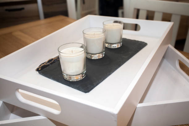 istock tray with set of candles in glasses on table 1166018951