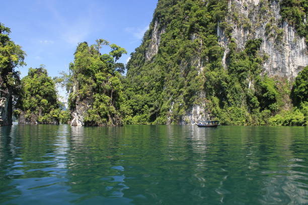 istock View from a boat at a rock formation on Cheow Lan Lake, Thailand 1166020035