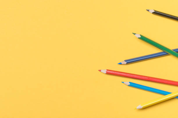 istock Educational concept, colored pencils on yellow background with space for your text 1166021856