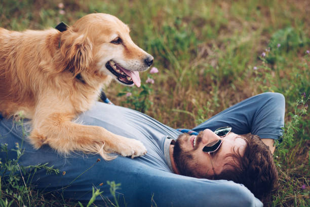istock Happy man outdoors with his dog 1166023264