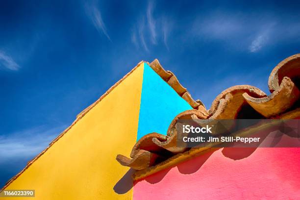 Spanish Styled Architecture With Tiled Roof And Colorful Outside Paint Stock Photo - Download Image Now