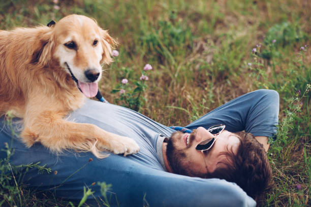 istock Happy man outdoors with his dog 1166023575