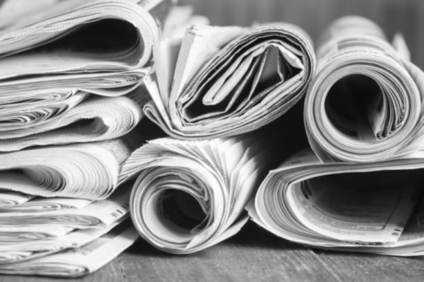 istock News newspapers stacked and folded, toning 1166024157