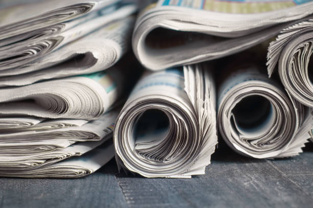 istock News newspapers stacked and folded, toning 1166024174