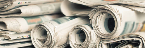 istock News newspapers stacked and folded, toning 1166024181