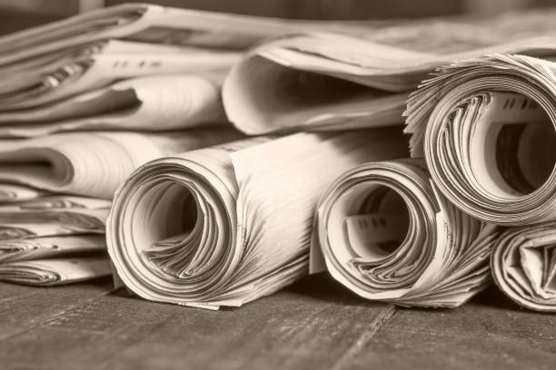 istock News newspapers stacked and folded, toning 1166024186
