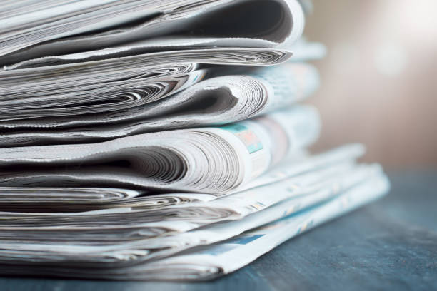istock News newspapers stacked and folded, toning 1166024187