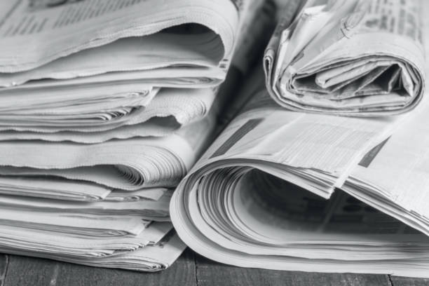 istock News newspapers stacked and folded, toning 1166024235