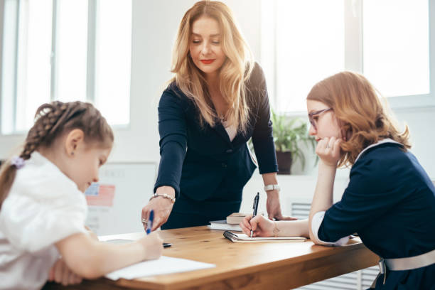 Female teacher pupils school lesson in classroom. Female teacher pupils school lesson in classroom. teacher classroom child education stock pictures, royalty-free photos & images