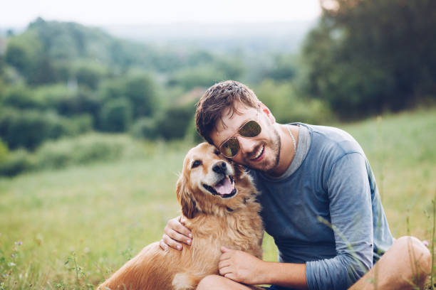 istock Happy man outdoors with his dog 1166027644