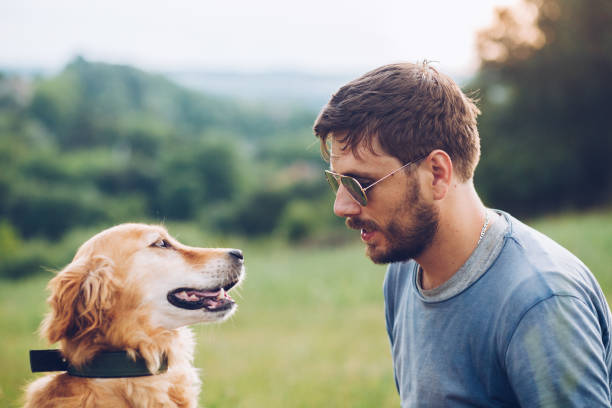istock Happy man outdoors with his dog 1166027824