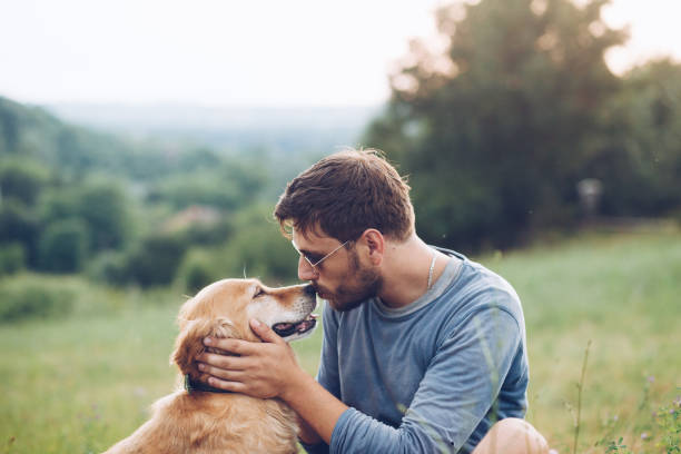 istock Happy man outdoors with his dog 1166027911