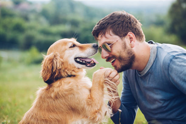 istock Happy man outdoors with his dog 1166027917
