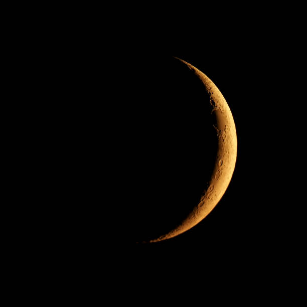 istock Waxing crescent moon seen with telescope 1166028539