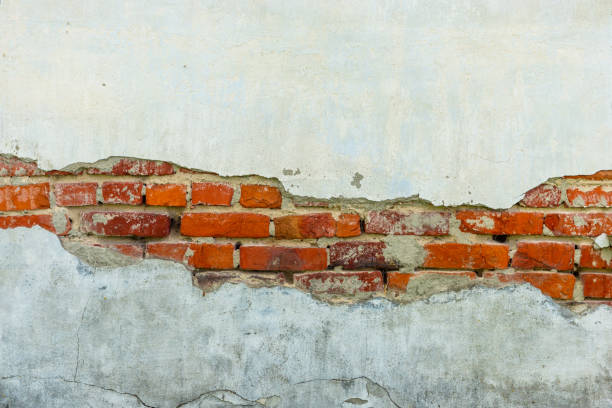 istock vintage rustic old red brick wall. some part cover with white clay with copy space 1166028897