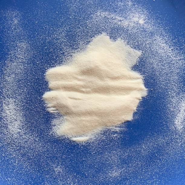 Collagen Peptides Collagen powder on blue plate amino acid photos stock pictures, royalty-free photos & images