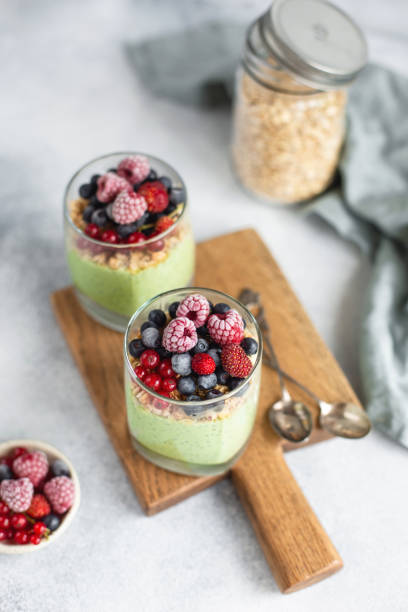 istock Chia pudding with matcha, granola and fresh berries. Selective focus. 1166031010