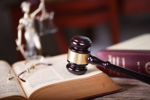 Law concept, sculpture and gavel stock photo
