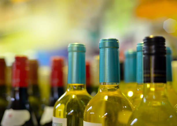 istock Bottles of wine in rows in liquor store 1166033145