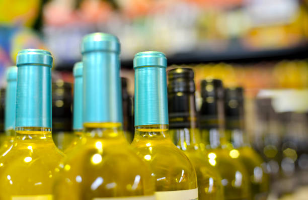 istock Bottles of wine in rows in liquor store 1166033164