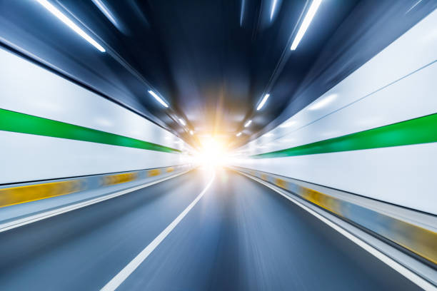 istock Blurry chromatic color tunnel car traffic motion blur. 1166033484