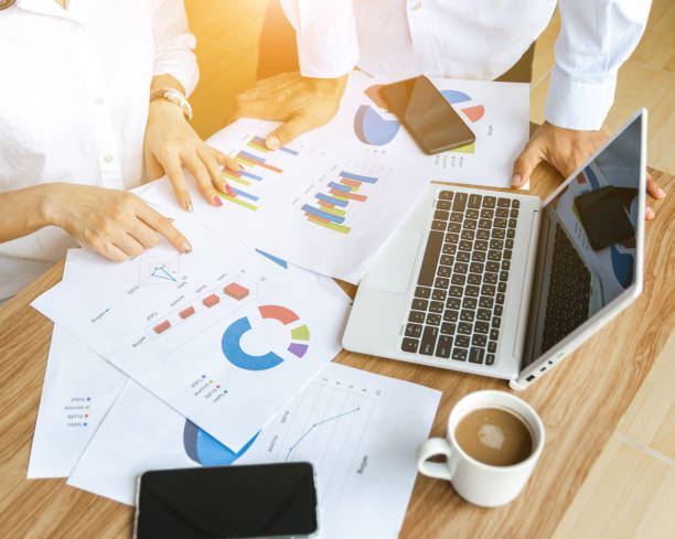 istock Business team work analyzing charts and graphs strategy concept modern laptop computer 1166035723