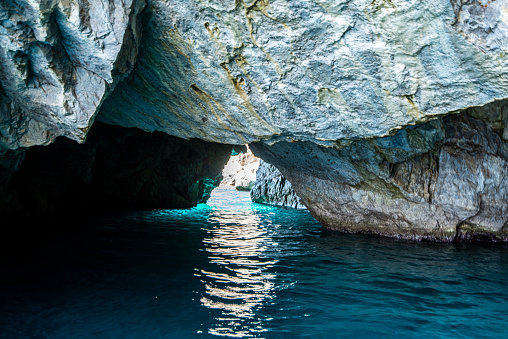 View of the green cave located in the south coast of the Island of Capri in the Tyrrhenian Sea in Italy.