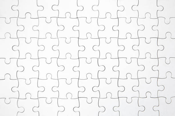 istock top view shot of white jigsaw puzzel background 1166036736