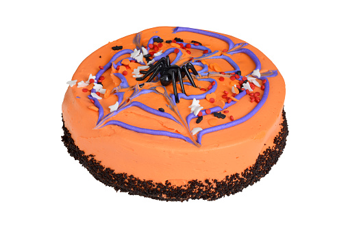 closeup orange Halloween cake with spider isolated on white background
