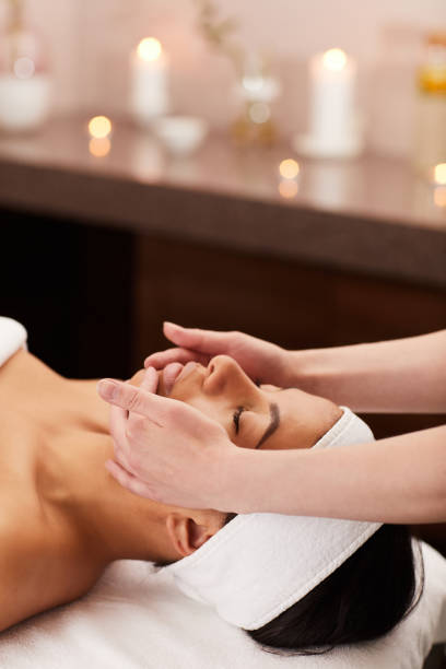 Young Woman Enjoying Face Massage