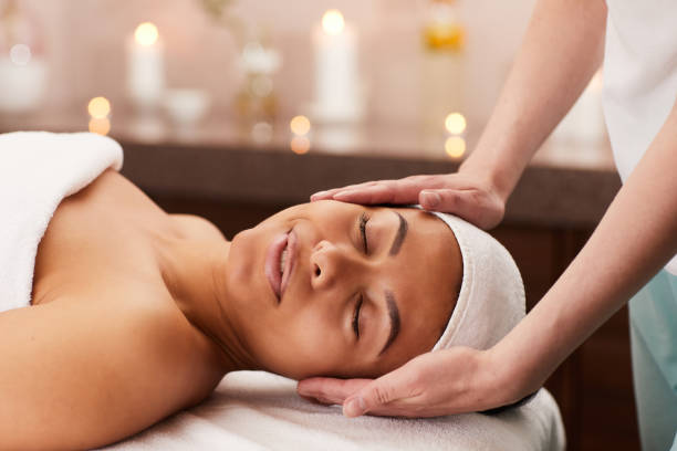 istock Beautiful Woman Enjoying Face Massage in Spa 1166039704