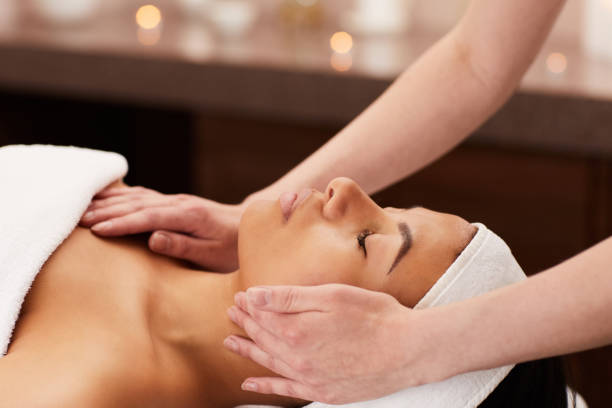 istock Beautiful Woman Enjoying Face Massage 1166039728