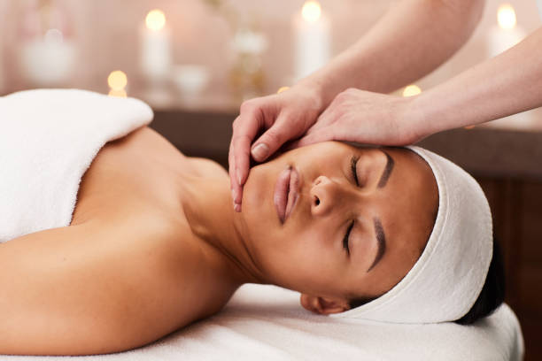 istock Woman Enjoying Face Massage in Spa 1166039733