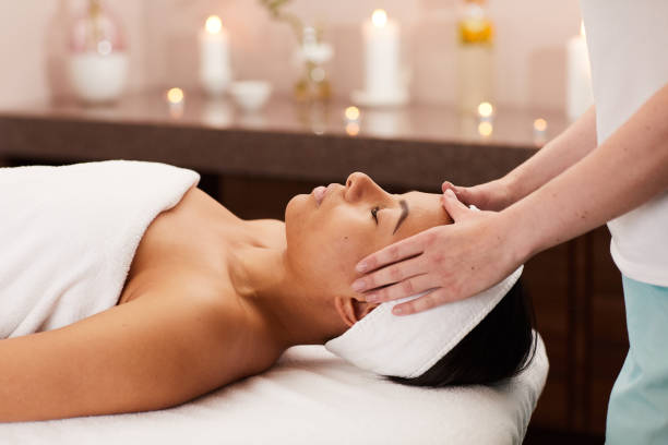 istock Young Woman Enjoying Face Massage 1166039850