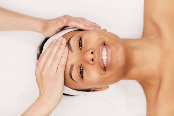 istock Mixed-Race Woman Enjoying Face Massage 1166039901