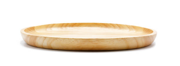Empty round wooden plate, isolated on white background.