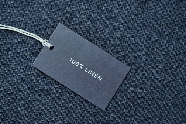 istock Label with composition of fabric on cloth background. 100% linen 1166040656