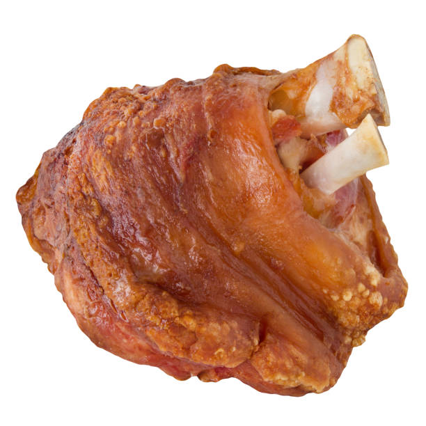 Grilled Schweinshaxe (German Pork Knuckle) isolated on white background