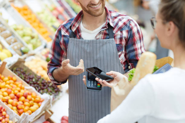 istock Customer Paying by Smartphone in Supermarket 1166040816