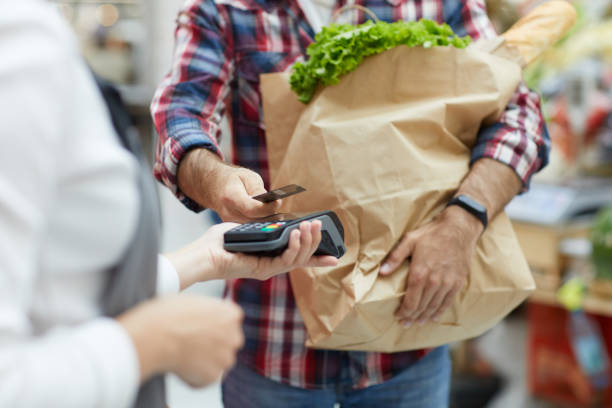 istock Customer Paying by NFC in Supermarket 1166040817