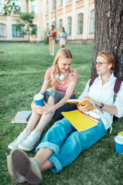 istock Girl laughing talking to her smart groupmate. 1166042850
