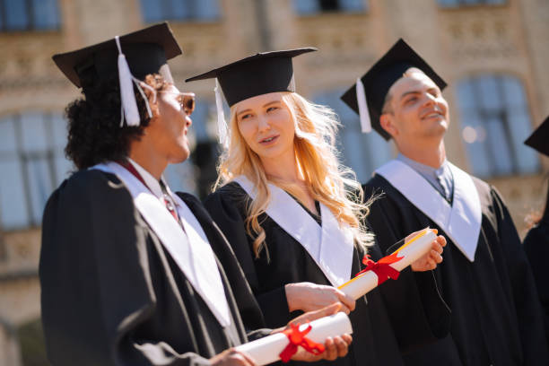 istock Girl and boy talking during their graduation. 1166042872