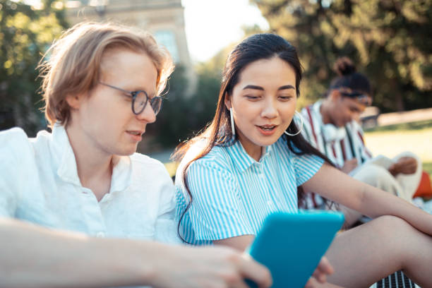 istock Smiling girl asking her groupmate about the hometask. 1166042906